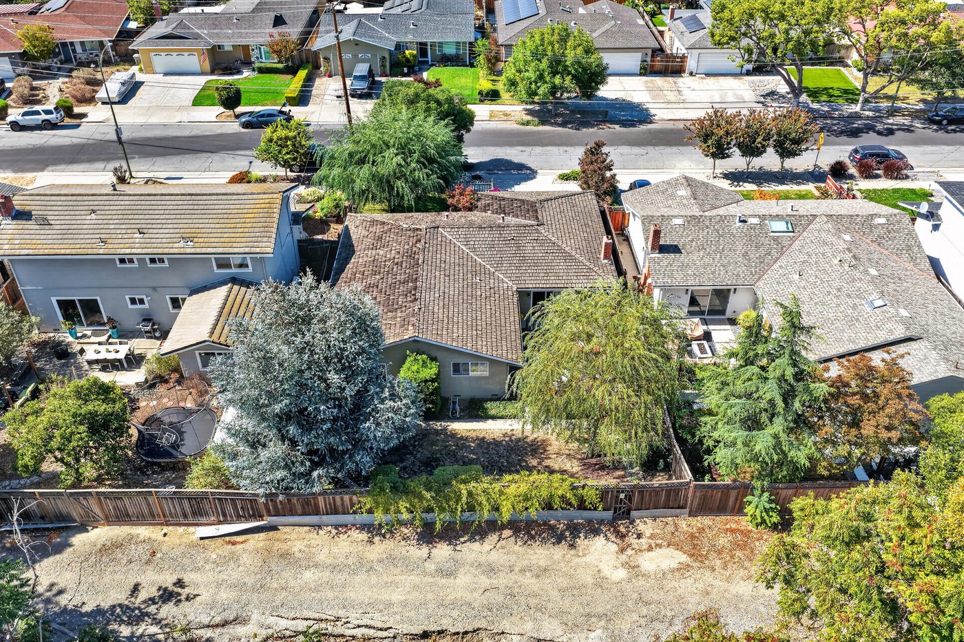 Delete: trees hide the backyard, dead grass