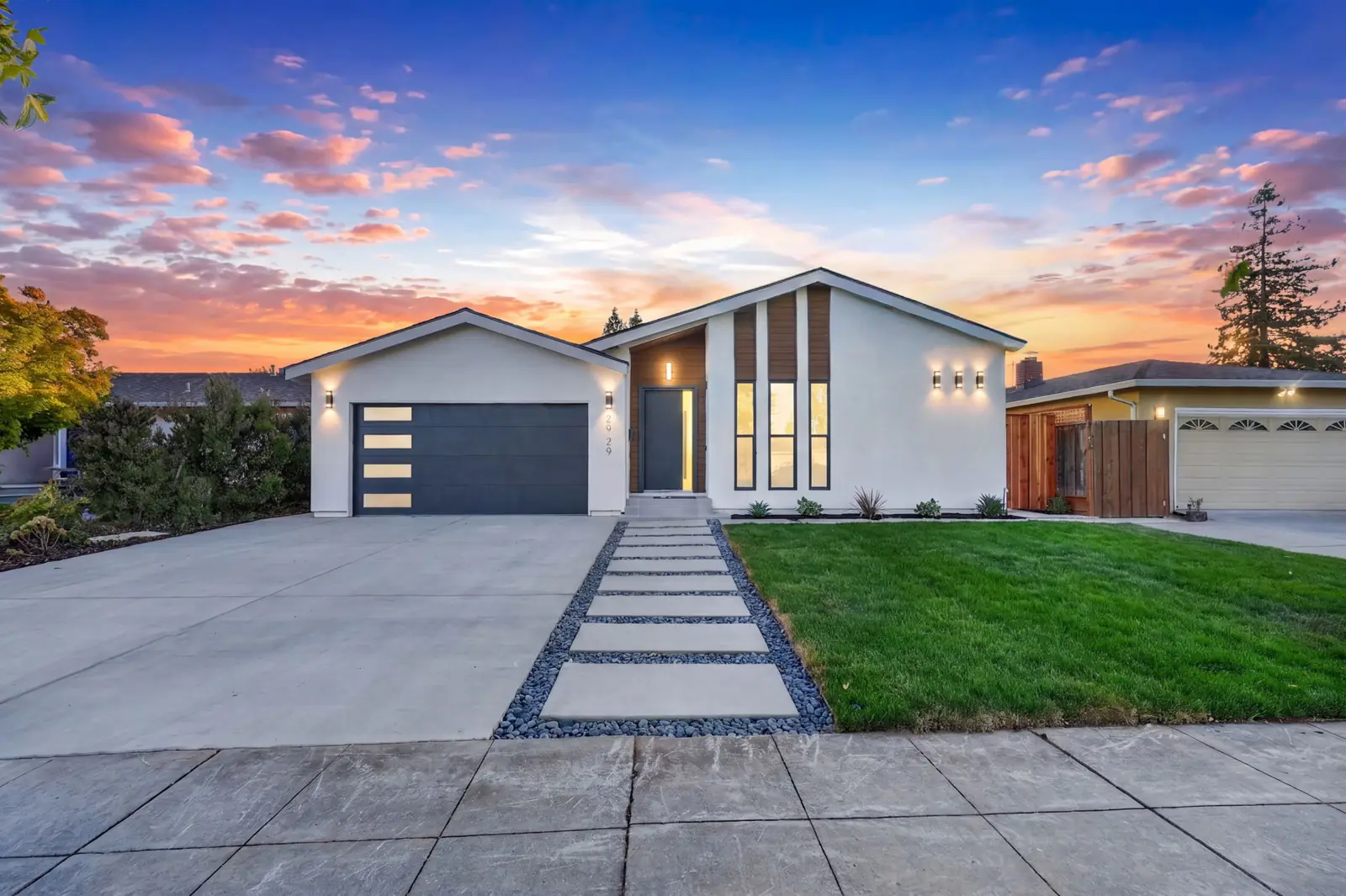 2929 Lexford Ave, San Jose, edited as virtual twilight with a sunset sky and lit windows
