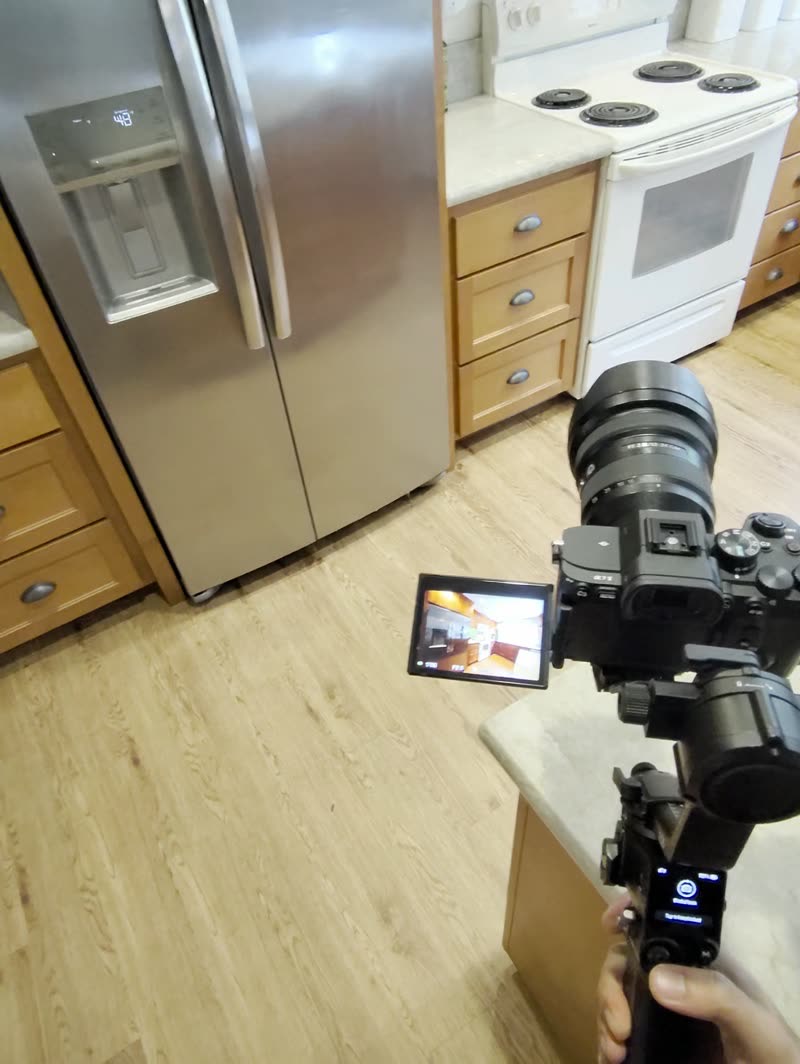 POV clip: shooting a kitchen handheld on a gimbal at cabinet height